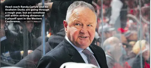  ?? — GETTY IMAGES ?? Head coach Randy Carlyle and his Anaheim Ducks are going through a rough year, but are somehow still within striking distance of a playoff spot in the Western Conference.