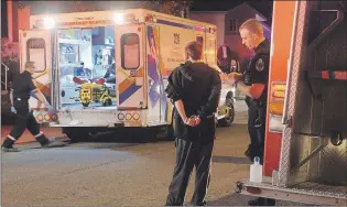  ??  ?? Police and paramedics deal with aftermath of an incident where a man reportedly hit three pedestrian­s with a car on Bartlett Place Saturday night. David Loveys, 20, (see inset) was charged with dangerous operation of a motor vehicle and assault with a...