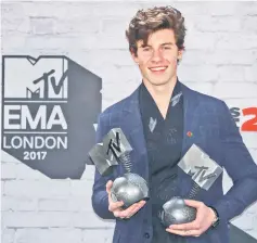  ??  ?? Canadian singer Shawn Mendes poses with his awards during the 2017 MTV Europe Music Awards at Wembley Arena in London, Britain Nov 12. — Reuters photo