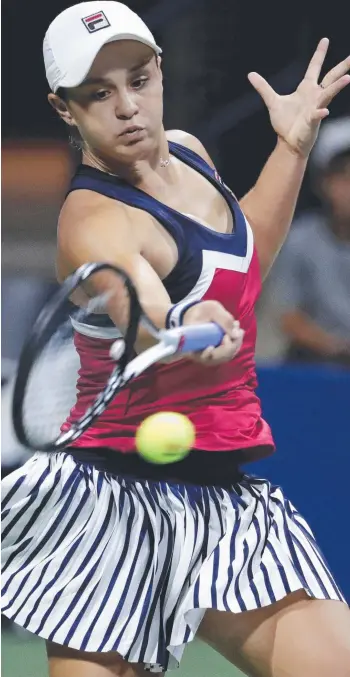  ?? Picture: AP/Julio Cortez ?? Ashleigh Barty returns a shot to Karolina Muchova during the third round of the US Open in New York