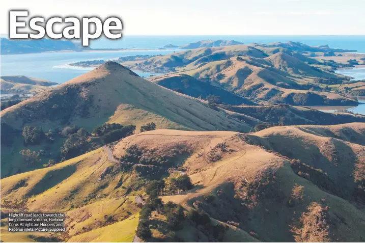  ??  ?? Highcliff road leads towards the long dormant volcano, Harbour Cone. At right are Hoopers and Papanui inlets. Picture: Supplied