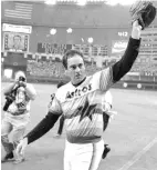  ?? Associated Press file photo ?? ■ Houston Astros' Nolan Ryan waves to the crowd on Sept. 26, 1981, after pitching his fifth career no-hitter, defeating the Los Angeles Dodgers, 5-0, in Houston.