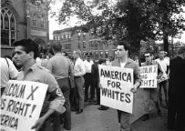  ?? ?? LEFT: A 1966 march in Chicago by members of the American Nazi Party across the street from the Greater Mount Hope Baptist Church. The church was the scene of a meeting between Martin Luther King Jr. and other civil rights workers.