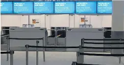  ??  ?? Deserted Monarch check-in desks at Gatwick Airport yesterday