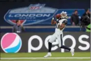  ?? TIM IRELAND — THE ASSOCIATED PRESS FILE ?? In this file photo, Los Angeles Rams wide receiver Tavon Austin (11) catches the ball as he warms-up for an NFL football game against Arizona Cardinals at Twickenham Stadium in London. An NFL team in London? An NBA franchise in Mexico City? We’re...