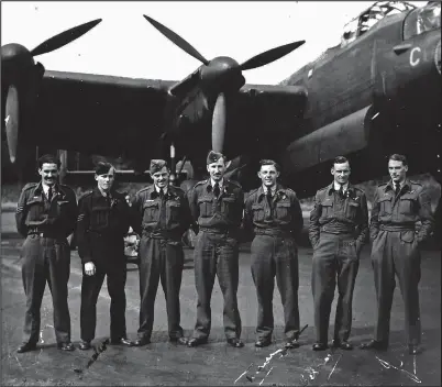  ??  ?? Courageous airmen: Pilot officer George Smith, far left, and the crew of his JB221 Lancaster Bomber