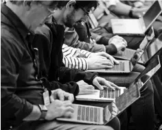  ?? — AFP photo ?? Tech writers take type on laptops during Amazon’s release event for new Alexa products and services at The Spheres in Seattle. The reorganiza­tion of the industry groupings, the biggest in the history of the system, affects three of the 11 sectors within the S&amp;P 500.