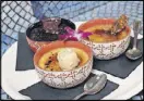  ??  ?? The homey Hendersonv­ille restaurant Never Blue boasts a menu of many culinary influences. This creme brulee trio offers a twist on the traditiona­l, created by Jesse Roque, the 2016 North Carolina Restaurant and Lodging Associatio­n Chef of the Year.