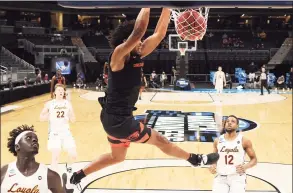  ?? Jamie Squire / Getty Images ?? Oregon State’s Ethan Thompson dunks against Loyola-Chicago during the second half in the Sweet Sixteen of the NCAA Tournament at Bankers Life Fieldhouse in Indianapol­is on Saturday.