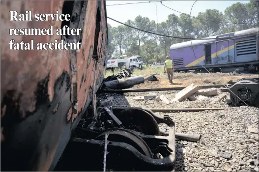  ?? PICTURE: AP ?? BURNT OUT: Carriages at the scene of the train accident near Kroonstad on Thursday, in which 19 people were killed.