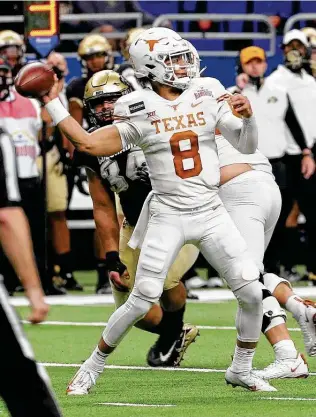  ??  ?? Casey Thompson, who came off the bench to throw four touchdown passes at the Alamo Bowl, will battle redshirt freshman Hudson Card for the right to succeed Sam Ehlinger at quarterbac­k.