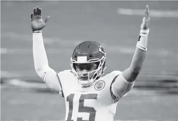  ?? CHRIS GRAYTHEN Getty Images ?? Chiefs quarterbac­k Patrick Mahomes reacts after a touchdown against the Saints during the first quarter at Mercedes-Benz Superdome. Mahomes has led Kansas City to a nine-game winning streak and a likely shot at the AFC’s top seed.