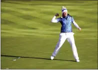  ?? PETER MORRISON — THE ASSOCIATED PRESS ?? Suzann Pettersen of Europe celebrates after holing a putt on the 18th green to win the Solheim cup against the US at Gleneagles, Auchterard­er, Scotland, Sunday.