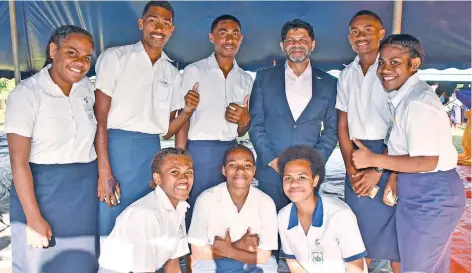  ?? Photo: DEPTFO News ?? The Attorney-General and Minister for Economy, Aiyaz Sayed-Khaiyum with some students of Nasesevia Secondary School after launching the Walesi platform on May 16, 2022.