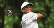  ?? MIKE EHRMANN / GETTY IMAGES ?? Tiger Woods made three straight birdies on the front nine and finished with three birdies over his last six holes for a 67, his best score at the Masters since the final round in 2011.