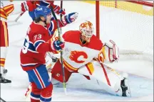  ?? CP PHOTO PAUL CHIASSON ?? Montreal Canadiens’ Tyler Toffoli celebrates his goal past Calgary Flames goaltender Jacob Markstrom during second period NHL hockey action in Montreal on Friday.