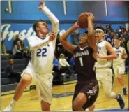  ?? DAVID M. JOHNSON - DJOHNSON@DIGITALFIR­STMEDIA.COM ?? Lansingbur­gh’s Mason Little (1) goes up for a shot as La Salle’s Seth LaForest (22) defends during a Colonial Council boys basketball game Tuesday at La Salle Institute in Troy, N.Y.