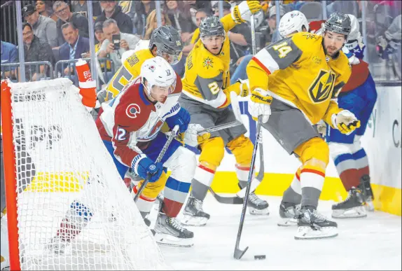  ?? ?? Avalanche center Jayson Megna and Golden Knights defenseman Nicolas Hague vie for the puck during the first period. The Knights fell to 4-2 in losing to short-handed Colorado, and power plays have been an issue in each loss.