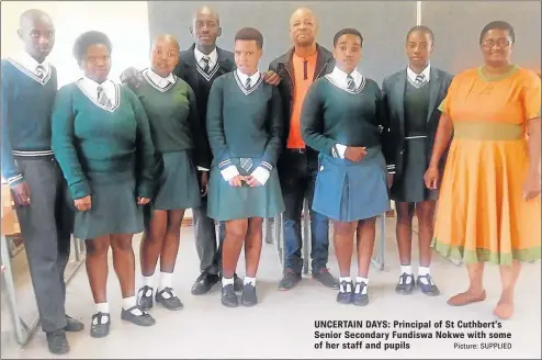  ?? Picture: SUPPLIED ?? UNCERTAIN DAYS: Principal of St Cuthbert’s Senior Secondary Fundiswa Nokwe with some of her staff and pupils