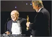  ?? Chris Pizzello Invision / Associated Press ?? HONORARY OSCAR Jeff Bridges, right, presents Lynn Stalmaster an honorary Oscar in 2016, saying the casting director had been “very, very good to me, and to the entire Bridges family.”