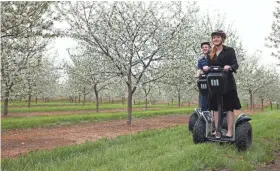  ?? TODD DACQUISTO ?? Segway tours take visitors through a blooming orchard in Door County in the spring.