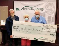  ?? Courtesy photo / Sonora Area Foundation ?? Sonora Area Foundation Bill Polley (left) presents a check for a $40,000 unrestrict­ed grant on Monday to Jamestown couple Hazel (middle) and Dick Mitchell (right), founders of the homeless advocacy organizati­on Give Someone a Chance, which was bestowed with the foundation’s annual Irving J. Symons Award this year.