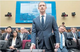  ?? ANDREW HARNIK/THE ASSOCIATED PRESS ?? At this week’s hearings, Zuckerberg wore a navy suit in contrast to his usual hoodie and T-shirt.