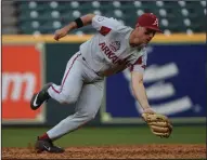  ?? (Special to the Democrat-Gazette/Chris Daigle) ?? Arkansas freshman second baseman Robert Moore scoops up a ground ball during the Razorbacks’ loss to Oklahoma on Friday at Minute Maid Park in Houston. Moore hit his second home run of the season, but the Hogs suffered their first loss.