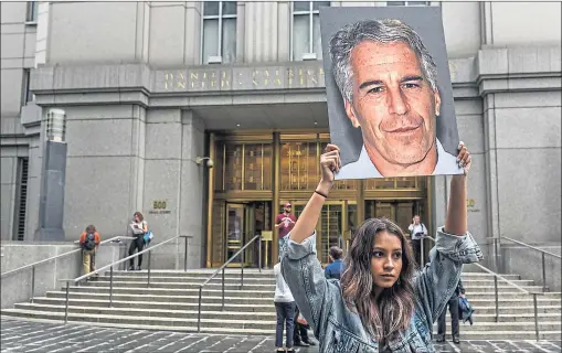  ??  ?? Protesters outside the federal courthouse in New York at an earlier court case involving Jeffrey Epstein