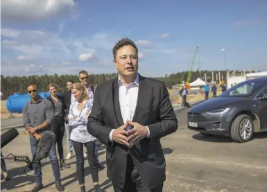  ?? Maja Hitij / Getty Images ?? Tesla CEO Elon Musk tours a factory site in Berlin this month. Others are planned in Shanghai and Texas.