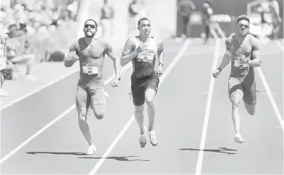  ?? — Gambar AFP ?? SAINGAN HEBAT: Knighton beraksi dalam perlumbaan separuh akhir 200 meter lelaki di Hayward Field di Eugene, Oregon, kelmarin.