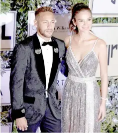  ?? — Reuters photo ?? Brazil’sNeymar and his girlfriend Bruna Marquezine pose on the red carpet during an auction to raise funds for his Institute Project Neymar Jr in Sao Paulo, Brazil in this July 19 file photo.