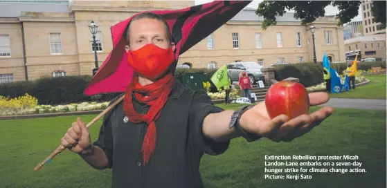  ?? ?? Extinction Rebellion protester Micah Landon-Lane embarks on a seven-day hunger strike for climate change action. Picture: Kenji Sato