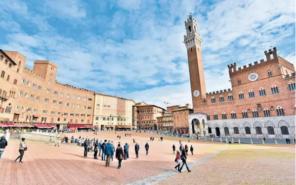  ?? CAMERON HEWITT/RICK STEVES’EUROPE ?? Siena’s main square and gathering place is Il Campo. The great shell-shaped piazza features a sloped redbrick floor fanning out from the City Hall tower.