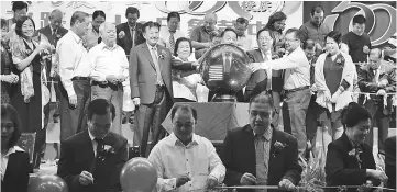  ??  ?? (standing middle row) Lau (third right), Wong (fourth right) with others at the grand opening of the school’s golden jubilee celebratio­n.