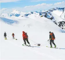  ?? JILL PELTO ?? Ben Pelto, Kindy Gosal, Alexandre Bevington and Jesse Milner take radar measuremen­ts of the Nordic Glacier in the southern B.C. Interior. Their work supersedes earlier computer modelling estimates.