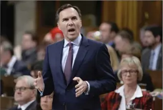  ?? ADRIAN WYLD, THE CANADIAN PRESS ?? Bill Morneau is expected to tell G20 ministers that Trump’s order runs contrary to Canada’s trading interests.