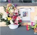  ?? LISA MARIA GARZA/STAFF ?? Fans left flowers and pictures on Sunday, June 10, 2018, at The Plaza Live in memory of singer Christina Grimmie.