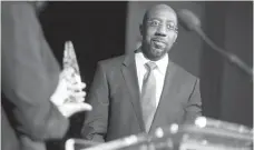  ?? Athens Banner-Herald via Associated Press, File ?? The Rev. Raphael Gamaliel Warnock of Ebenezer Baptist Church in Atlanta, Georgia, receives a “President’s Fulfilling the Dream Award” Jan. 13, 2017, during a Martin Luther King Celebratio­n at the Tate Student Center at the University of Georgia in...