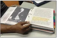  ?? ?? Pastor Charlie Grant shows on July 11 a binder of informatio­n he has about Rosenwald Schools he gathered as he worked to restore a building in Hampton, S.C.