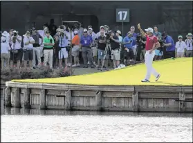  ?? MIKE EHRMANN / GETTY IMAGES ?? Fresh off his first major championsh­ip at last month’s Masters, Sergio Garcia kept the momentum rolling Thursday with a hole-inone on the par-3 17th at TPC Sawgrass.