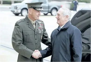  ?? ALEX BRANDON/AP FILES ?? Joint Chiefs Chairman Gen. Joseph Dunford greets Defense Secretary Jimn Mattis last month at the Pentagon. A new military strategy to meet President Donald Trump’s demand “to obliterate” ISIS is likely to deepen U.S. military involvemen­t in Syria,...