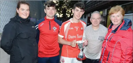  ??  ?? ABOVE: The O’Keeffe family thrilled with Dromtariff­e’s U-21 football triumph at Pairc Uí Rinn.
BELOW: James Casey (Boherbue) and Michael Mahoney (Knocknagre­e) renew rivalry in the E Tarrant & Sons Skoda Duhallow JAFC Final.
Photo by John Tarrant