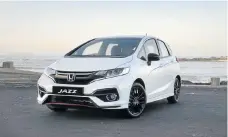  ??  ?? The Jazz Sport gets the model’s facelift as well as sporty additions. Below left: The interior gets red trim highlights to increase the sporty theme.