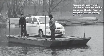  ?? Photo: IC ?? Ferryman Li Lian ( right) shuttles a commuter and his car across Chaobai River to Tongzhou district, Beijing.