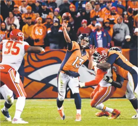  ?? John Leyba, The Denver Post ?? Broncos quarterbac­k Trevor Siemian throws a pass during overtime against the Kansas City Chiefs last month at Sports Authority Field at Mile High. The teams meet again Sunday at Kansas City.