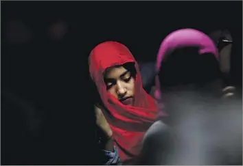  ?? Photograph­s by Francine Orr Los Angeles Times ?? LEZETH ESTRADA, 15, of Anaheim celebrates World Hijab Day at the Islamic Society of Orange County mosque in Garden Grove in February. There are an estimated 200,000 Latino Muslims in the U.S.