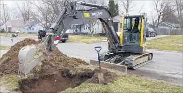  ?? Chris Ehrmann Associated Press ?? MICHIGAN AGREED to replace 18,000 lead or galvanized-steel water lines in Flint. The city “can finally look forward to a long-term solution to a catastroph­e that has devastated the community,” a lawyer said.