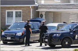  ?? PAT NABONG – THE ASSOCIATED PRESS ?? Police officers stand outside outside Memorial Chapel of Waukegan in Waukegan, Ill., where Eduardo Uvaldo's funeral Saturday in Waukegan, Ill.