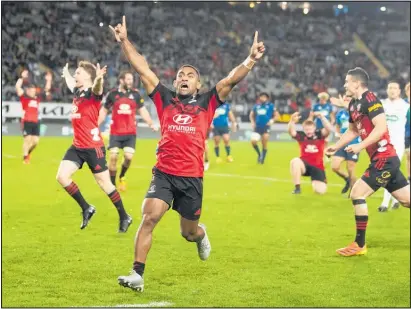  ?? Photo / Photosport ?? Sevu Reece leads the Crusaders’ victory sprint after they claimed a 13th Super Rugby trophy.